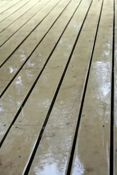 How do I Build a Waterproof Ceiling Under a Deck? | Hunker Underdeck Waterproofing, Low Maintenance Landscape Ideas, Under Deck Roofing, Patio Step, Deck Ceiling, Low Maintenance Landscape, Under Deck Ceiling, Under Deck Storage, Remodeling House