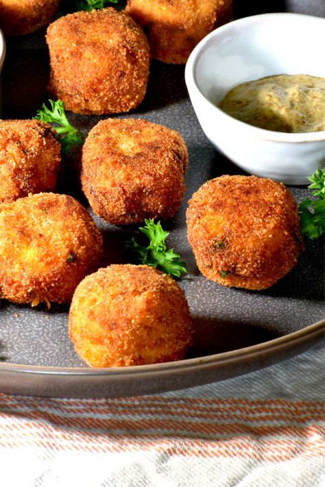 Sauerkraut balls! Add some Bavarian flair to your party with these crispy little nuggets, famous in beer halls across Germany. German Sauerkraut Balls, Saurkraut Balls Baked, Kraut Balls Recipe, German Sauerkraut Balls Recipe, German Sauerkraut Recipes, Recipes Using Sauerkraut, Sauerkraut Balls, German Appetizers, German Sauerkraut