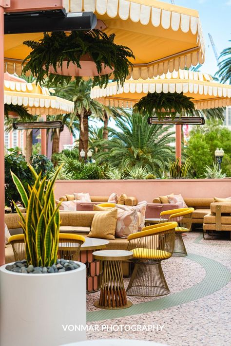 Spotted this mid-century outdoor patio while visiting Las Vegas, this pastel pink, seafoam green, with pops of yellow is a stunning combination for outdoor dining. Create your own mid-century desert oasis. Pink And Green Restaurant, Mid Century Restaurant, Mid Century Patio, Mexican Restaurant Design, Mid Century Outdoor, Home Decor Business, Home Decor Product, Architecture Firms, Decor Business