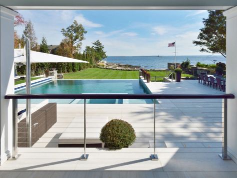 View Through Stainless Cable Railing. The Railing Posts have the surface plates and hardware covered by matching escutcheon plates. Fence Around Pool, Steel Cable Railing, Pool Rails, Stainless Steel Cable Railing, Old Greenwich, Greenwich Connecticut, Railings Outdoor, Stainless Steel Railing, Exterior Stairs