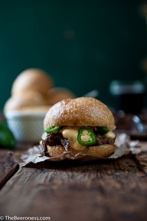 Porter Braised Beef Short Ribs Sandwiches with Jalapeño Beer Cheese Sauce  #beer #recipe #tailgating Ribs Sandwich, Short Rib Sandwich, Cheddar Sauce, Beer Cheese Sauce, Braised Beef Short Ribs, Rib Sandwich, Beer Recipe, Cooking With Beer, Jalapeno Cheddar