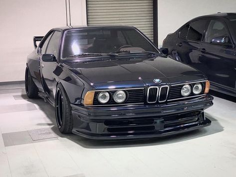 BMW 6 Series E24 Wide body Kit DTM style Read the full story dedicated to this awesome black wide body BMW 6-Series E24 on Eurolism #bmw Bmw Wide Body Kit, Bmw E30 Wide Body Kit, Bmw 635 Csi, Bmw 635, Car Builds, Bmw E24, Serie Bmw, Bmw E38, Wide Body Kits