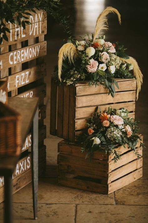 Rustic wooden crates topped with floral arrangements including pampas grass to create a beautiful backdrop for the order of the day sign. Barn Wedding Flowers, Rustic Barn Wedding Reception, Kim Wedding, Barn Wedding Ideas, Outdoor Wedding Backdrops, Wedding Reception Entrance, Karen Alexander, Reception Entrance, Buffet Ideas