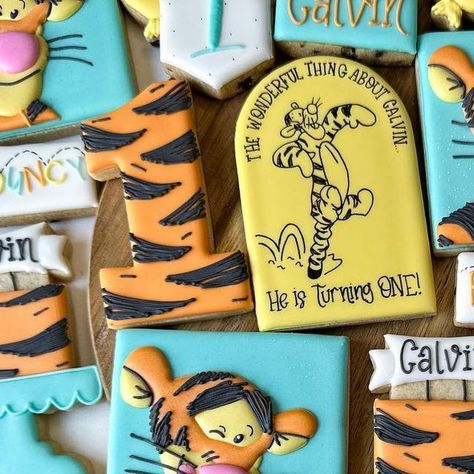 Rachel Wiehe| Sugar Cookie Artist on Instagram: "Bouncy, bouncy, bouncy; Fun, fun, fun! The wonderful thing about Calvin…he is turning 1! • This tigger set was such a blast to do!! What makes it even better…the minis are chocolate chip cookies😍 Scroll to the end to see the invite it was designed after! Usually it’s Pooh with a little bit of Tigger, but this fully Tigger set makes me jump for joy! He always was one of my favorite characters in Winnie the Pooh! Did you have a favorite!? Or too fa Tigger Cookies Decorated, Tigger Themed First Birthday, Tigger Birthday Party Ideas, Tigger Birthday Party, Tigger Party, Tigger Birthday, Fun Fun Fun, Jump For Joy, Cookie Inspiration