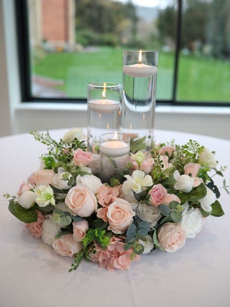 Pink Candle Centerpieces Wedding, White And Pink Roses Centerpieces, Quicksand Rose Wedding Centerpieces, Light Pink And White Flower Centerpieces, Cylinder Vase Centerpiece Wedding, Wedding Party Table Ideas, Light Pink Rose Centerpiece, Pink Green White Wedding Candle Centerpiece With Flowers, Blush Centerpiece