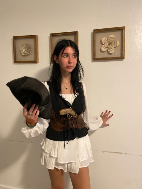 pirate. pirate costume. halloween. cute pirate costume. women pirate costume. aesthetic pirate costume. halloween costume. halloween costume ideas. halloween ideas. simple pirate costume. pirate hat. fake gun. corset. black hair. white dress. white romper. halloween inspo. Grunge Pirate Costume, Aesthetic Pirate Costume, Cute Pirate Costume Women, Black Hair White Dress, Pirate Costume Aesthetic, Simple Pirate Costume, Cute Pirate Costume, Women Pirate Costume, Pirate Costume Women