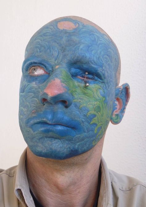 Blue And Green Ink Amazing Men Face Wave Tattoo #tuerto #pirsin 10 Tattoo, African Tattoo, Leopard Tattoos, Clown Tattoo, Facial Tattoos, Alien Tattoo, Blue Tattoo, Tattoo Fails, Asian Tattoos