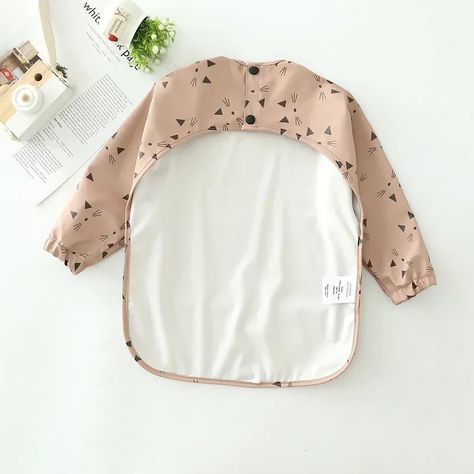 Introducing the perfect solution for messy meal times - our Long sleeve Smock Bib! 🍽️👶 This bib is designed to protect your little one's clothes from stains and spills, with long sleeves to cover their arms and a large pocket to catch any stray food. Made from soft, flexible material, it is comfortable to wear and easy to clean. Perfect for babies and toddlers alike, this is a must-have for busy parents who want to make meal times stress-free. Order now and make feeding time a breeze! 🛍️💯 #lo... Meal Times, Feeding Time, Busy Parents, Meal Time, Kids Stuff, Baby Accessories, Smocking, Baby Toddler, Order Now