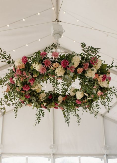 Large floral statement pieces like this gorgeous chandelier bring the wow factor at a wedding reception and can help set the tone for a truly special evening. White Floral Chandelier, Flower Chandelier Wedding, Floral Chandelier Wedding, Chandelier Wedding Decor, Bridal Suite Decor, Hanging Flowers Wedding, Hanging Flower Arrangements, Forest Theme Wedding, Sunflower Themed Wedding