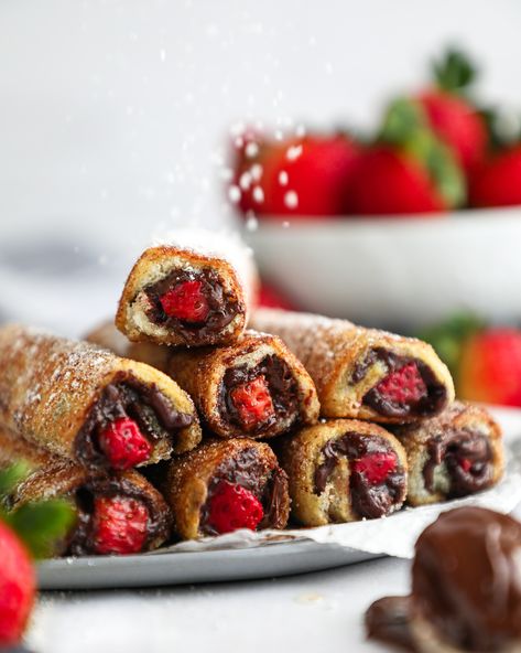 Sweet strawberries and rich chocolate hazelnut spread are stuffed inside a french toast roll up and tossed in cinnamon sugar! This festive breakfast idea is so much fun to make and so easy too! (They would be perfect for Valentine's Day, Mother's Day or even for a bridal shower brunch!) Festive Breakfast, Quick And Easy Breakfast Ideas, Nut Butter Cookies, Toast Roll Ups, French Toast Roll Ups, French Toast Rolls, Strawberries Chocolate, Garlic Chicken Wings, Strawberry Butter