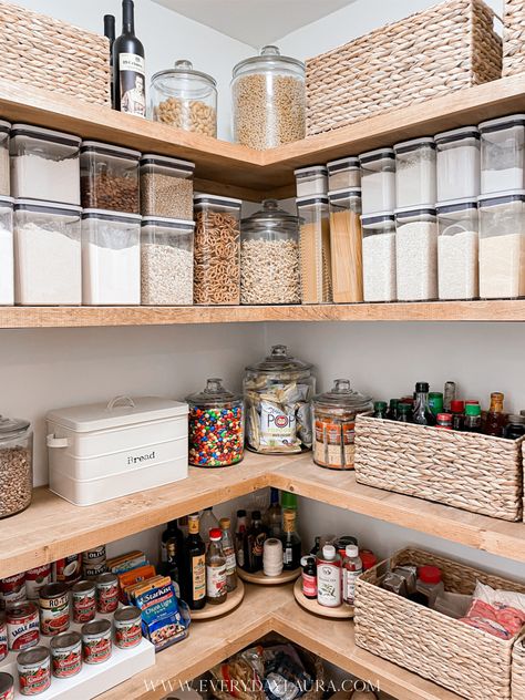 Corner pantry, pantry with black glass door, organized pantry, pantry with wood stained shelves, baskets inside pantry, space saving pantry ideas Open Shelving Walk In Pantry, Open Face Pantry, Walk In Corner Pantry Ideas Layout, Corner Pantry Organization Ideas Walk In, Pantry Shelving Dimensions, L Shape Pantry Organization, Pantry L Shaped Shelves, Corner Pantry Makeover Diy, Pantry Floor Organization