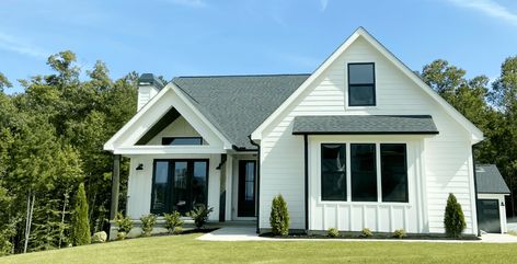 This home is Featuring Hardie Siding Exterior. White Horizontal Siding and White Board & Batten (Verticle) Siding. Hardie Siding is a Low Maintenance Product. Horizontal Siding, Modern Siding, Hardie Board, Hardie Siding, Board Batten, Modern Farmhouse Kitchens, Exterior Siding, Modern Exterior, White Board