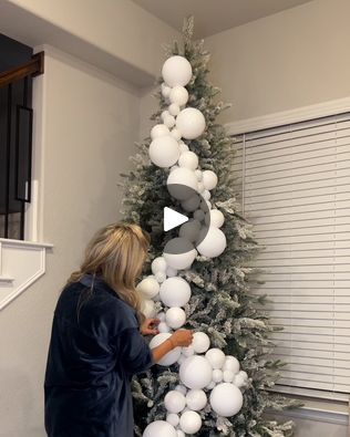 6M views · 65K reactions | Unique way of decorating a Christmas tree | A new way to decorate your tree this year! 🎄 | By LADbible | Facebook Christmas Tree Big Ornaments Decorating Ideas, Christmas Tree With Big Balls, Christmas Trees With Large Ornaments, Snowball Christmas Tree, Christmas Ball Garland For Tree, Cascade Ornaments On Tree, Christmas Ball Garland Decorating Ideas, How To Decorate My Christmas Tree, Christmas Ball Garland On Tree