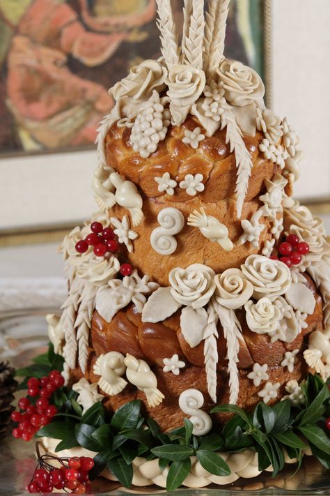 Two-tier traditional Ukrainian wedding bread "Korovai" including wheat, flowers, doves, swirls, pine cones, grapes, braids, periwinkle and kalyna. Ukrainian Wedding Korovai, Traditional Ukrainian Wedding, Ukrainian Wedding Bread, Ukrainian Wedding Cake, Ukrainian Wedding Decorations, Ukrainian Wedding Traditions, Ukrainian Wedding Dress, Slavic Wedding, Ukraine Wedding