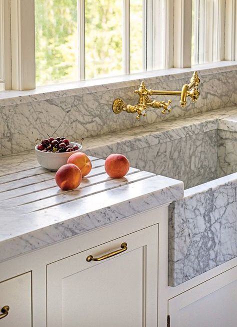 Grooves are cut into the marble surrounding this marble sink. The grooves are a nice feature, regardless of what counter material is selected, as they help to eliminate the splashes and puddles that accumulate around the sink. Kitchen Marble Ideas. Top Kitchen Trends, Curved Kitchen, Kitchen Cabinet Trends, Painted Kitchen Cabinets Colors, Green Kitchen Cabinets, New Kitchen Designs, Marble Sinks, Kitchen Farmhouse, Sink Design