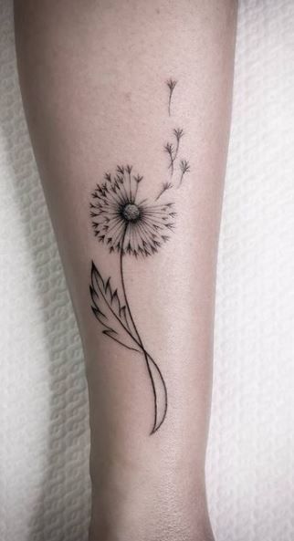 Dandelion Strength Tattoo, Tattoos For Wanderers, Dandelion And Four Leaf Clover Tattoo, Most Popular Womens Tattoos, Small Tattoos Dandelion Ideas, Ankle Tattoo Dandelion, Tattoo Designs Dandelion, Collarbone Dandelion Tattoo, Dandy Lion Tattoos Dandelion Art