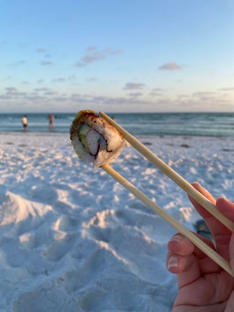 a picture of sushi with a sunset in the background Sushi Asthetic Picture, Eating On The Beach, Sushi On The Beach, Sushi Boat Aesthetic, Sushi At The Beach, Aesthetic Sushi Pics, Sushi On The Beach Aesthetic, Florida Pics, Sushi Aesthetic