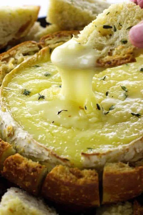 This baked Brie in a bread bowl is an easy appetizer. Garlic butter, sourdough bread, Brie and fresh thyme all baked to a gooey goodness. The bread bowl is a pull-apart for dippers. #appetizer #partyfood #bakedcheese Garlic Butter Baked Brie In A Bread Bowl, Bread Brie Bowl, Brie In Sourdough Bowl, Bread Bowl Brie, Brie In A Bread Bowl, Brie Baked In Bread, Brie Bread Bowl Baked, Brie Bowl Bread, Baked Brie In Sourdough Bread Bowl