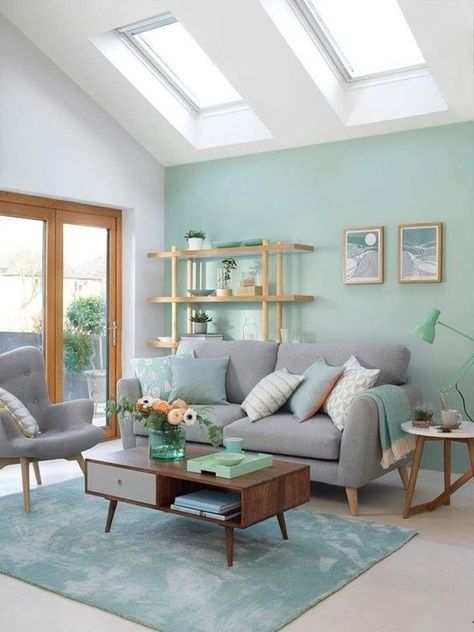 a modern living room with a light green accent wall, a green rug and a lamp, green pillows and accessories Cat Warna Pastel, Light Green Walls, Green Living Room Decor, Living Room Green, House Interiors, Living Room Colors, Small Living Room, Cool Rooms, Room Colors