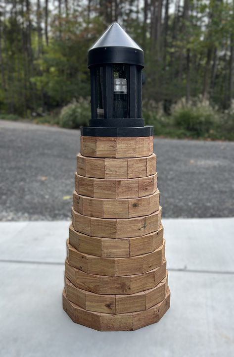 lighthouse built out of pressure-treated lumber 2 x 4's Diy Lighthouse Crafts, Yard Lighthouse, Lighthouse Plans, Well Pump Cover, Diy Lighthouse, Lighthouse Crafts, Diy Lawn, Pump Cover, Well Pump