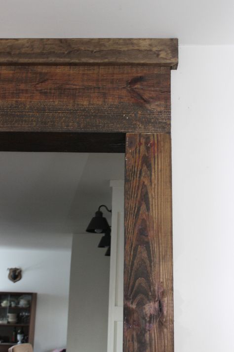 I love the look of exposed wood beams and the little punch of rustic that they give.  But big, chunky, REAL, SOLID WOOD beams are not so wallet-friendly. As it always does, our renovation ran higher than we hoped and being thrifty is always a goal.  So, real wood beams that were pretty and perfect … Door Frame Molding, Rent House, Rustic Door, Faux Wood Beams, Faux Beams, Rustic Window, Revere Pewter, Interior Painting, Rustic Doors