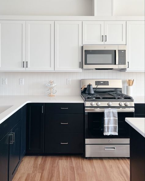 What’s Black and White and Chrome all over? Our kitchen design in this Terrace Park Drive home. We love the contrast of black and white which provides a clean slate to show off the chrome light fixtures and faucet. We used simple 3”x6” subway tile on the backsplash, but arranged them in a modern vertical grid pattern. We also loved mixing the finishes on the cabinet hardware by using chrome hardware on the lower cabinets and matte black hardware on the upper cabinets! Follow my shop @andrewa Black And Chrome Kitchen Hardware, White Uppers Black Lowers, Black Lower Cabinets White Upper, Chrome Kitchen Hardware, Chrome Light Fixtures, Black Lower Cabinets, White Upper Cabinets, White Shaker Kitchen Cabinets, Terrace Park