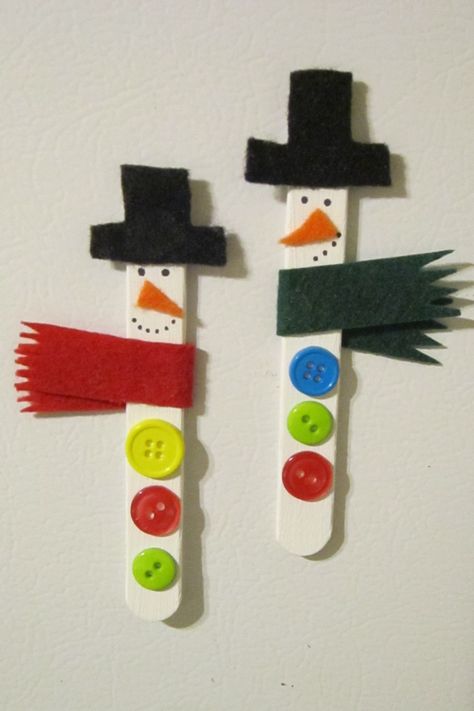 I made these! :)  Snowman popsicle sticks - paint popsicle sticks white, glue on felt hat, scarf, and nose, draw eyes and mouth with Sharpie, and glue on buttons! (I also put magnetic tape on the back to make cute fridge magnets.) Snowman Magnets, Prek Christmas, Cute Fridge Magnets, Popsicle Stick Christmas Crafts, Cute Fridge, Popsicle Stick Crafts For Kids, Handprint Christmas Tree, Handprint Christmas, Snowman Christmas Cards