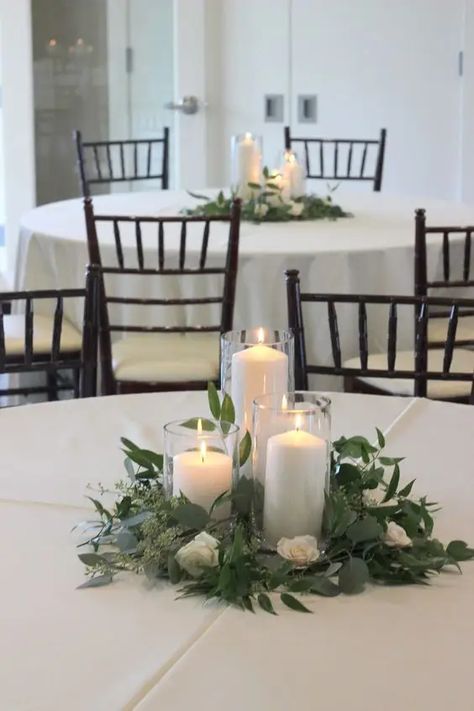 Green Wedding Centerpieces, Greenery Wedding Centerpieces, Rustic Wedding Decorations, White Pillar Candles, White Wedding Flowers, Wedding Table Decorations, Candle Centerpieces, Wedding Table Centerpieces, White Candles