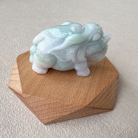 This masterfully hand-carved jade elephant figurine is a stunning work of art, crafted from high-quality jadeite jade. The figurine beautifully combines light purple and light green hues, which blend seamlessly across its form, highlighting the natural beauty and delicate translucency of the jadeite. The elephant itself is a symbol of strength, wisdom, and stability in many cultures, making this figurine not only an exquisite decorative item but also a meaningful symbol. The craftsmanship is... Carved Jade Jewelry For Wedding, Unique White Jade Jewelry, Carved Jade, Baby Buddha, Luxury Carved Jade Jewelry, Feng Shui Decor, Jade Sculpture Chinese, Gemstone Art, Unique Sculptures