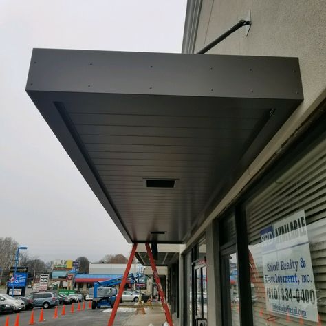 MASA Extrudeck canopy with lights at Grant Plaza in Philadelphia, PA. #architecture #design #metal #manufacturing #Americanmade Entrance Canopy Design, Canopy With Lights, Metal Door Canopy, Building Canopy, Metal Awnings, House Canopy, Canopy Ideas, Canopy Glass, Aluminum Awnings