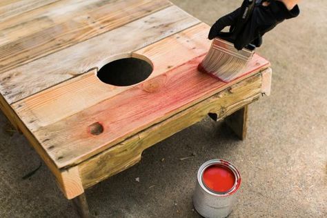 Using a palm sander and a fine grit paper, sand the rough spots down so that the bags will slide a bit when they hit the boards (Image 14). Dust off boards after sanding. To add vintage color, dip the tip of a dry brush into latex paint, barely getting paint on the bristles. Using this dry brush method, lightly sweep color onto the boards (Image 15). To add a white stripe, protect the sides using craft paper secured with painters tape. Lightly sweep white spray paint down the vertical center ... Diy Cornhole Boards From Pallets, Backyard Games Kids, Diy Cornhole, Diy Cornhole Boards, Decorative Lanterns, Corn Hole Diy, Relaxing Backyard, Pallet Project, Cornhole Game