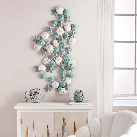 Whether you’re looking to complete a room with some beach wall art or you want to go for a full-on beach theme in your home, you’ll be glad to know th... | Shell Decorative Wall Sculpture #WallDecor #CoastalWallDecor #CoastallWalls #BeachDecor Coastal Floral Arrangements Beach Themes, Coastal Farmhouse Living Room Decor, Coastal Wall Decor Ideas, Sea Shell Wall Art, Sitting Mermaid, Beachy Bedroom, Iris Scott, Palm City, Office Hallway