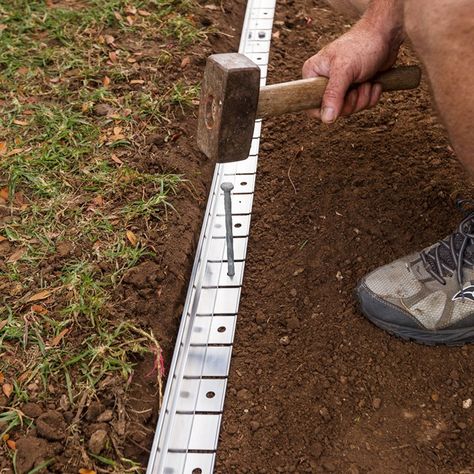 Paving alternative: How to make a gravel path | Better Homes and Gardens Gravel And Stepping Stone Pathway, Gravel And Paving Garden Ideas, Edging For Gravel Pathway, Diy Paving Stones, Gravel Pathway Walkways, Gravel Path Edging, Wheelchair Accessible Garden Paths, Garden Paths And Walkways Cheap, Self Binding Gravel Path