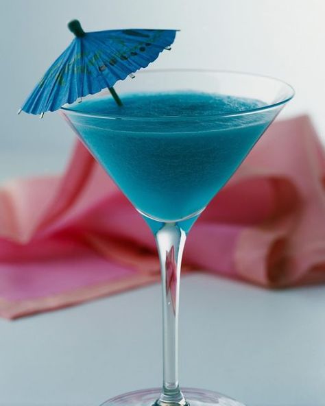 Blue Hawaiian Cocktail, Cocktail Umbrella, Hawaiian Cocktails, Cocktail Umbrellas, Tiki Bars, Blue Drinks, Cocktail Serving, Blue Food Coloring, Blue Cocktails