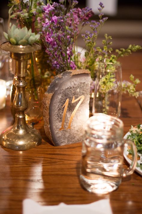 #table-numbers  Photography: Elizabeth McDonnell Photography - elizabethmcdonnellphotography.com  Read More: http://www.stylemepretty.com/2014/10/23/golden-bohemian-affair-in-arizona/ Crystals Table Decor, Gemstone Wedding Decor, Gemstone Centerpieces, Crystal Gem Wedding Decor, Geode Centerpiece, Geode Wedding Theme, Crystal Table Numbers, Geode Table Numbers, Agate Wedding Decor