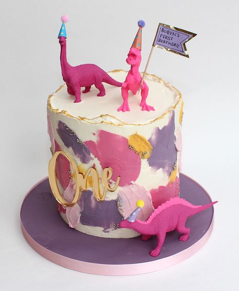 pink dinosaur cake | An abstract buttercream first birthday … | Flickr Pink Dino Birthday Cake, Dinosaur Birthday Party Pinata, Pink Dinosaur Themed Birthday Party, Pink Dinosaur Birthday Cake, Pink Dinosaur Party Cake, First Birthday Girl Dinosaur Theme, Pastel Dinosaur Cake, Three Rex Birthday Party Girl Cake, Girl Dinosaur Birthday Party Cake