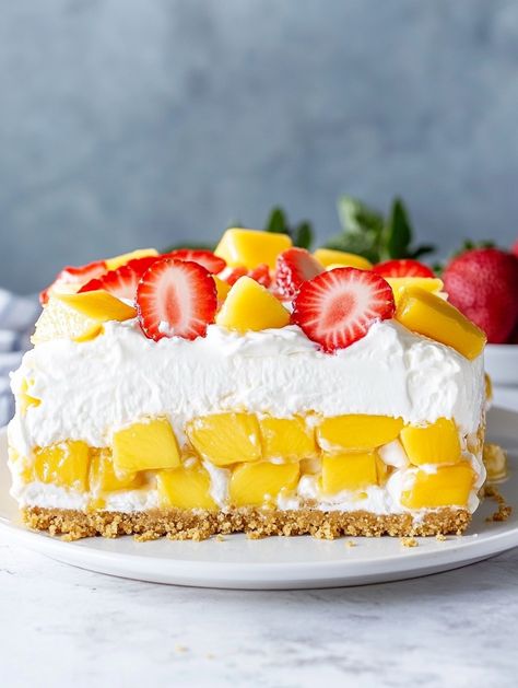 Strawberry Mango Delight Cake   𝗜𝗻𝗴𝗿𝗲𝗱𝗶𝗲𝗻𝘁𝘀 🥭 For the Graham Cracker Crust: 1 cup graham cracker crumbs 🍪 ½ cup unsalted butter (melted) 🧈 ¼ cup granulated sugar 🍬 For the Filling: 16 oz cream cheese (softened) 🧀 1 cup whipped cream 🧴 1 cup powdered sugar 🍬 1 tsp vanilla extract 🍨 1 cup diced strawberries 🍓 1 cup diced mango 🥭 For Topping and Garnish: Sliced strawberries 🍓 Diced mango 🥭 Fresh mint leaves 🌿 Diced Strawberries, Mango Delight, Sliced Strawberries, Mango Cake, Cracker Crust, Fresh Mint Leaves, Graham Cracker Crust, Graham Cracker Crumbs, Graham Cracker