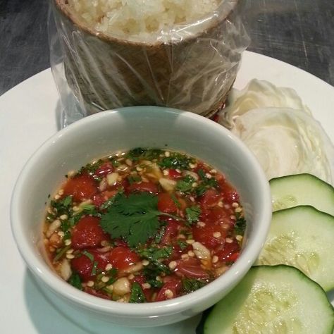 Laotian Jeow Som,  recipe consist pounded 5 bird eye chilis and 3 clove garlic with mortar and pestle, add 1 1/2 tbsp of sugar,.4 tbsp of fish sauce (3 crabs brand the best), 2 tbsp lime juice, chopped cilantro, optional added chopped cherry tomato.  This jeow som typically serve as dipping sauce for any type of grilled meat, fish, perfect with seafood.  It also can be a complete meal with sticky rice. Jeow Som, Laos Recipes, Laotian Food, Lao Recipes, Rice Asian, Hmong Food, Lao Food, Asian Sauces, Laos Food