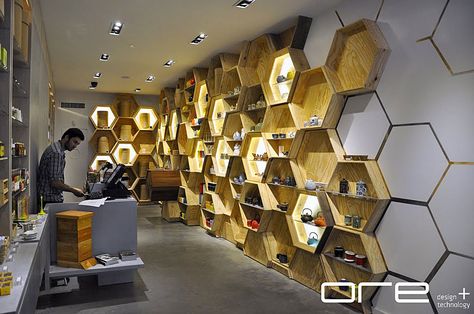 Tea and Honey | ORE Design + Technology | Archinect Logo Bee, Honey Store, Karaoke Room, Honeycomb Shelves, Honey Shop, Retail Interior Design, Industrial Living, Industrial Livingroom, Design Technology