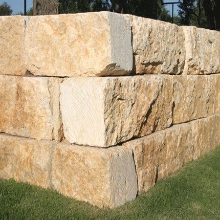 Natural stone block made of limestone. various colors used or landscaping Landscape Retaining Wall, Texas Limestone, Boulder Wall, Salado Texas, River Cabins, Landscaping Blocks, Retaining Wall Block, Limestone Block, Stone Walls Garden