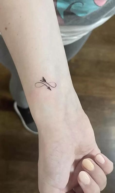 The Meanings Behind The Arrow Tattoo: A Growing Trend Feather Arrow Tattoo, Infinity Arrow Tattoo, Arrow Meaning, Mens Arrow Tattoo, Meaning Of Arrow Tattoo, Sagittarius Tattoo Designs, Arrow Tattoos For Women, New Beginning Tattoo, Small Arrow Tattoos