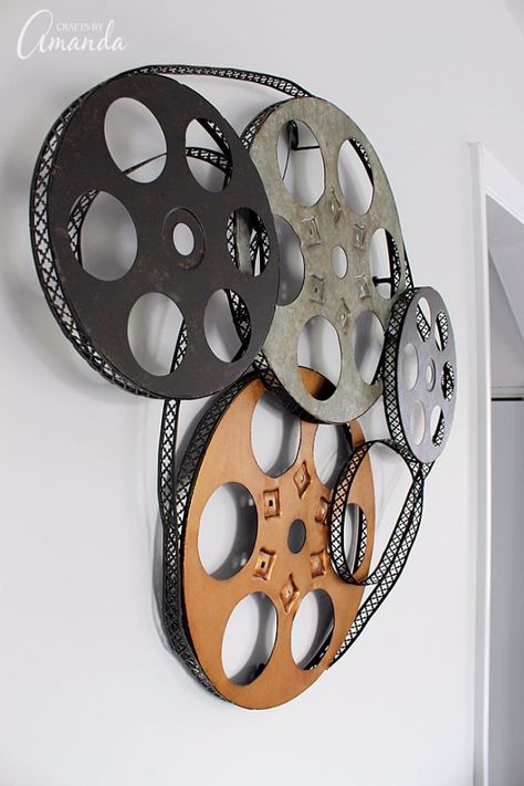 DIY Media Room Ideas - Metal Movie Reel Wall Art - Do It Yourslef TV Consoles, Wall Art, Sofas and Seating, Chairs, TV Stands, Remote Holders and Shelving Tutorials - Creative Furniture for Movie Rooms and Video Game Stations http://diyjoy.com/diy-media-room-ideas Movie Room Wall Decor, Mini Theater Room, Mini Theater, Movie Themed Rooms, Media Room Decor, Deco Cinema, Theater Room Decor, Movie Theater Decor, Movie Theater Rooms