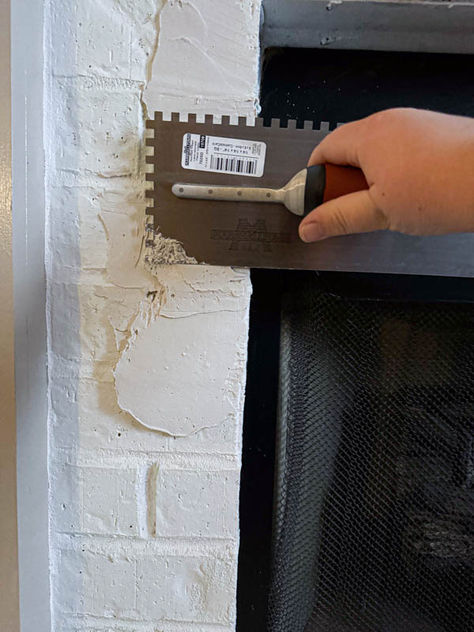 adding mortar to brick to lay tile on How To Smooth Out Brick Fireplace, How To Make Brick Fireplace Look Like Stone, Painting Over Brick Fireplace, Redo A Brick Fireplace, Install Brick Fireplace, Fireplace Tile Over Brick, How To Remove Paint From Brick Fireplace, Resurfacing Brick Fireplace, Removing Paint From Brick Fireplace