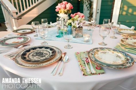 mix matched china. I really want to do this, but not sure if it will just be a waste because we won't want to preset the tables for a buffet? I think it's gorgeous though and will be really fun to build the collection over the year (thrift stores, yard sales, estate sales, etc) Vintage Wedding Table Settings, Mismatched Plates, Vintage Wedding Table, Mismatched China, Wedding China, Tafel Decor, Eclectic Wedding, Shabby Chic Wedding, Wedding Table Decorations