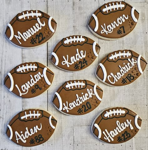 Football cookies are festive treats shaped like footballs e jerseys. These cookies are popular at tailgates, birthday parties, and Super Bowl gatherings. They can be customized with different colors to celebrate favorite teams or special events. These delightful snacks not only satisfy a sweet tooth but also add a fun thematic touch to any football-themed occasion.  Shipped individually bagged. Completely customizable  - Football (with or w/o name) - Jersey (with or w/o name or number) - Footbal Tailgate Football Party, Football Jersey Cookies, Football Field Cookies, Football Decorated Sugar Cookies, Football Cookies Royal Icing, Homecoming Cookies Decorated, Football Decorated Cookies, Fourth Down Football Birthday, Cheer Sugar Cookies