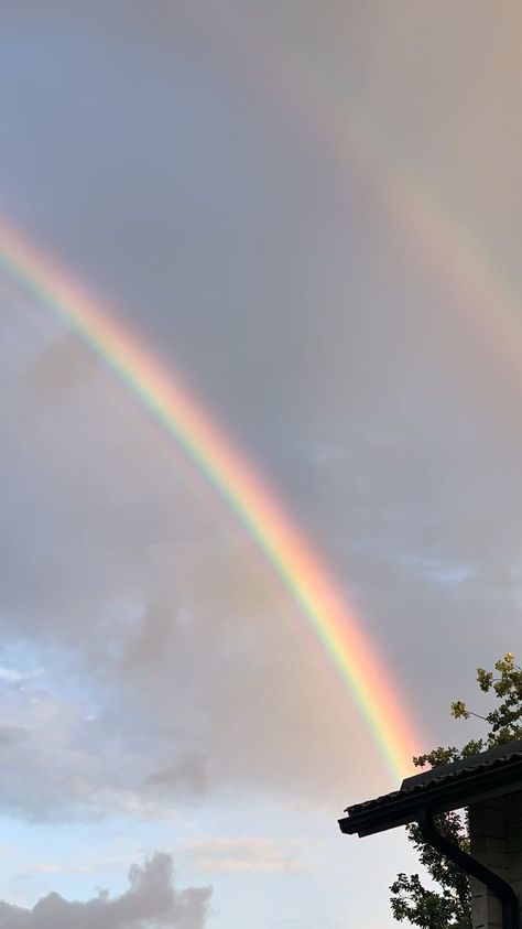 Double rainbow with dark clouds behind in the sky. Rainbow Nature, Rainbow Wallpaper Iphone, Grid Wallpaper, Rainbow Pictures, Sky Photography Nature, Double Rainbow, Rainbow Sky, Fluffy Clouds, Rainbow Aesthetic