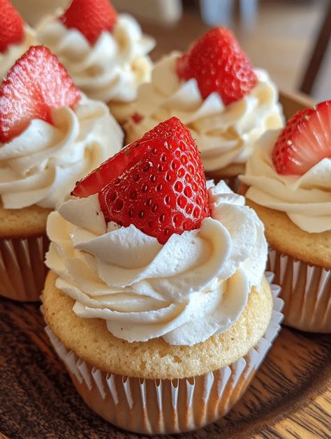 Who can resist the combination of strawberry and cheesecake? These Strawberry Cheesecake Cupcakes are a delightful twist on the classic dessert, creating a perfectly portioned treat that's both visually stunning and mouthwateringly delicious. With a moist cupcake base, a creamy cheesecake filling, and a rich whipped cream frosting, this recipe captures the essence of summer in every bite.... Easy Strawberry Shortcake Cupcakes, Cheesecake Filled Cupcakes, Strawberries And Cream Cupcakes, Strawberry Shortcake Cupcakes, Strawberry Cheesecake Cupcakes, Shortcake Cupcakes, Cheesecake Cupcakes Recipe, Muffin Cups Recipes, Cups Recipes