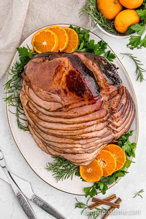 We are going to show you how to cook spiral ham that has the absolute best glaze. This easy ham recipe is tender and delicious for a great meal idea! Make this spiral ham in oven at Christmas, Easter and more. Each bite of this glazed baked ham is juicy and tender. #eatingonadime #spiralhamrecipe #ovenhowtocook #inovenbrownsugar Best Spiral Ham Recipe, Baked Meats, Baked Spiral Ham, Cooking Spiral Ham, Easy Ham Recipes, Honey Baked Ham Recipe, Oven Bag, Side Dishes For Ham, Ham Recipes Baked