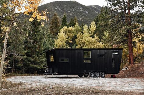 This tiny home features a bedroom loft and fold-out deck to balance comfort with adventure! - Yanko Design Black Camper, Corrugated Metal Siding, Tiny House Camper, Mud Room Entry, Steel Siding, Pine Walls, Clerestory Windows, Metal Siding, Interior Design Elements