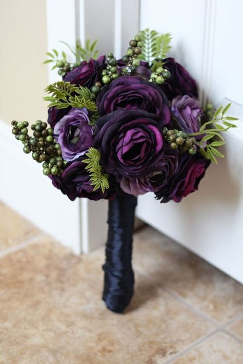 Dark purple silk ranunculus bouquet. Ranunculus are gorgeous soft headed flowers with whorls of delicate petals. Often difficult to find fresh year round. Purple Wedding Bouquets, Bouquet Bride, Winter Wedding Bouquet, Bridal Bouquet Flowers, Winter Bouquet, Purple Wedding Flowers, Winter Flowers, Halloween Wedding, Ranunculus